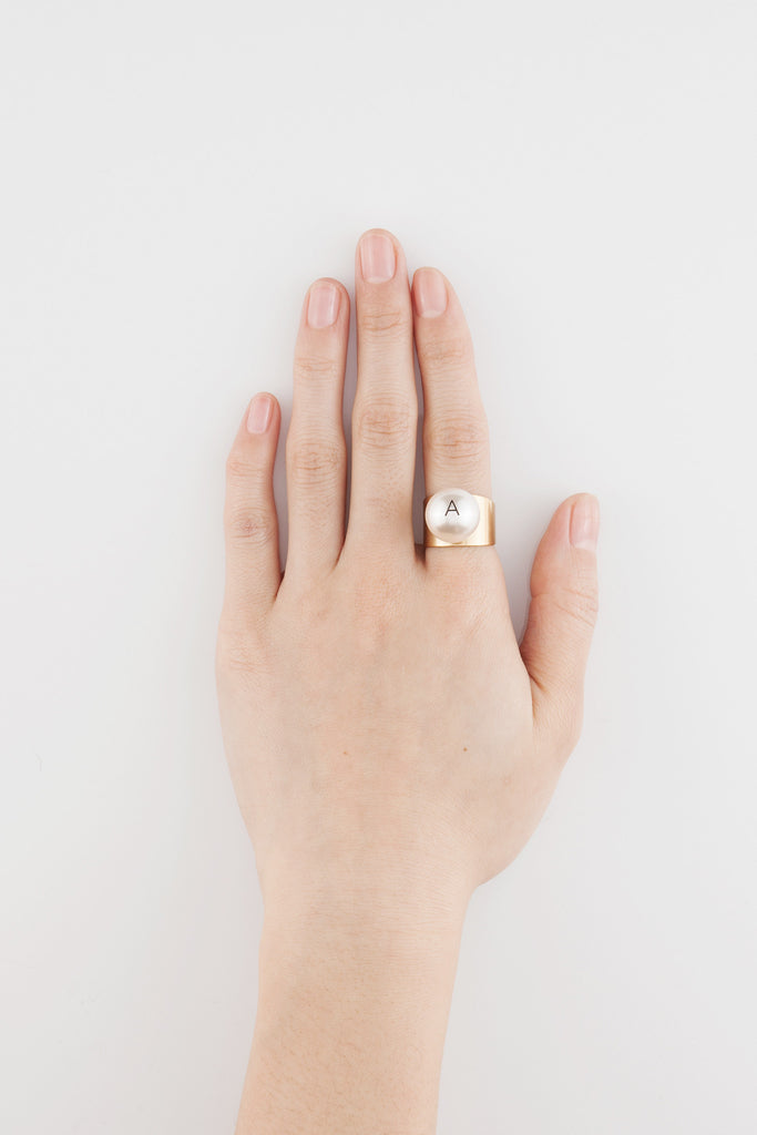 big pearl helvetica ring by Monday Edition